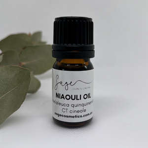 small brown bottle of niaouli essential oil, a native australian plant used in aromatherapy