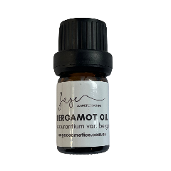 Bottle of Bergamot oil with a black cap on a white background