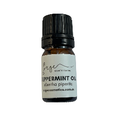 Bottle of peppermint oil with a white label on a white background
