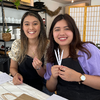Smiling women at a sage cosmetic coaching essential oil blending workshop