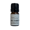 Bottle of lang ylang oil with a black cap on a white background