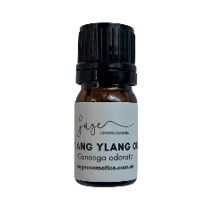 Bottle of lang ylang oil with a black cap on a white background