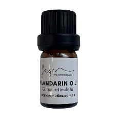 Bottle of Mandarin oil with a black cap on a white background