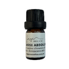 Bottle of rose absolue oil with a black cap on a white background