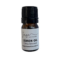 Bottle of lemon oil with a black cap on a white background