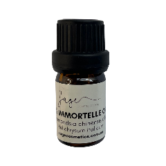 Bottle of Sage Cosmetics Immortelle oil on a white background