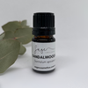 small bottle of sandalwood australian oil, used for calming, inner peace and chakra balancing.